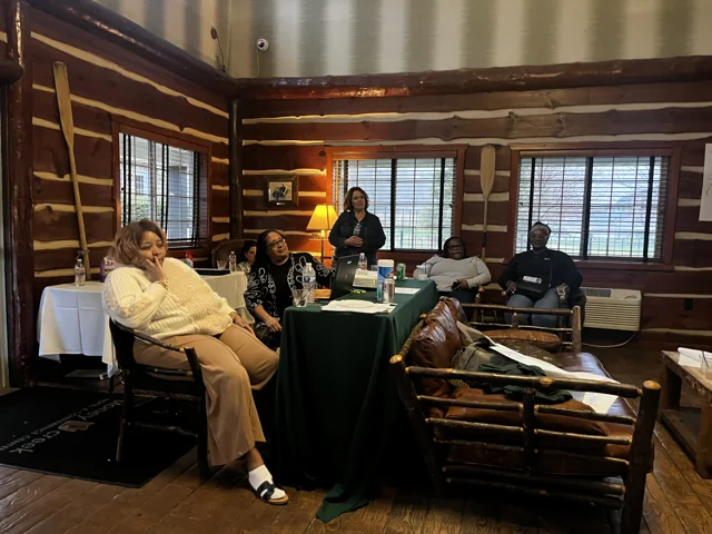Participants seated together in a meeting space