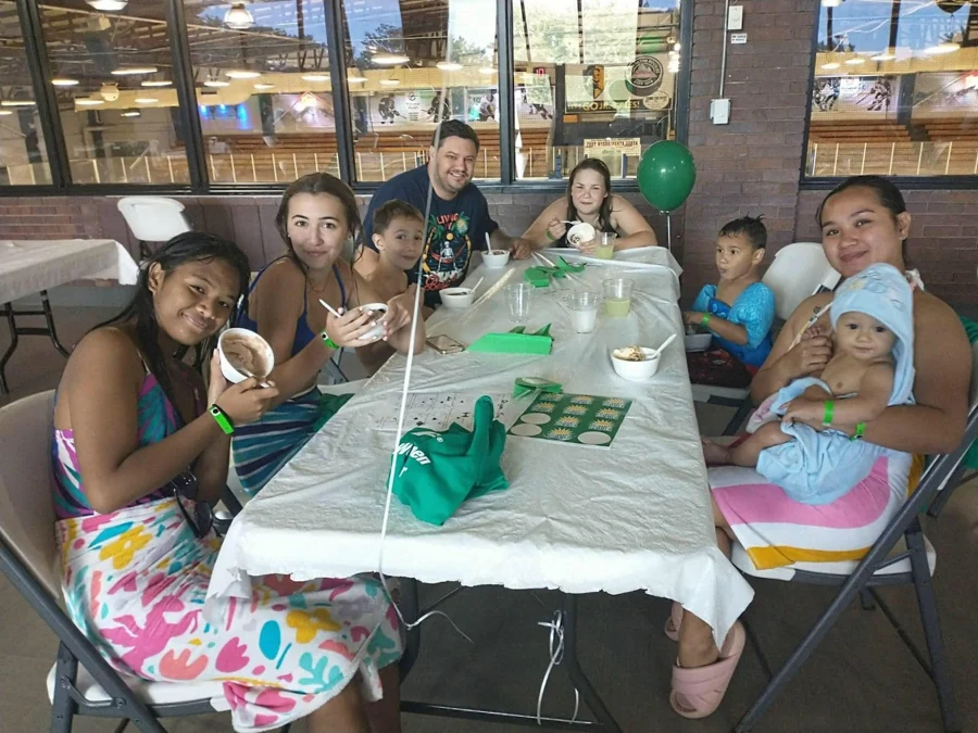 Members sharing time around a table